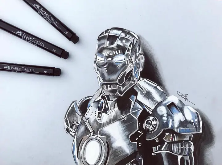 Dessin au feutre de l’armure d’Iron Man, à côté de trois feutres